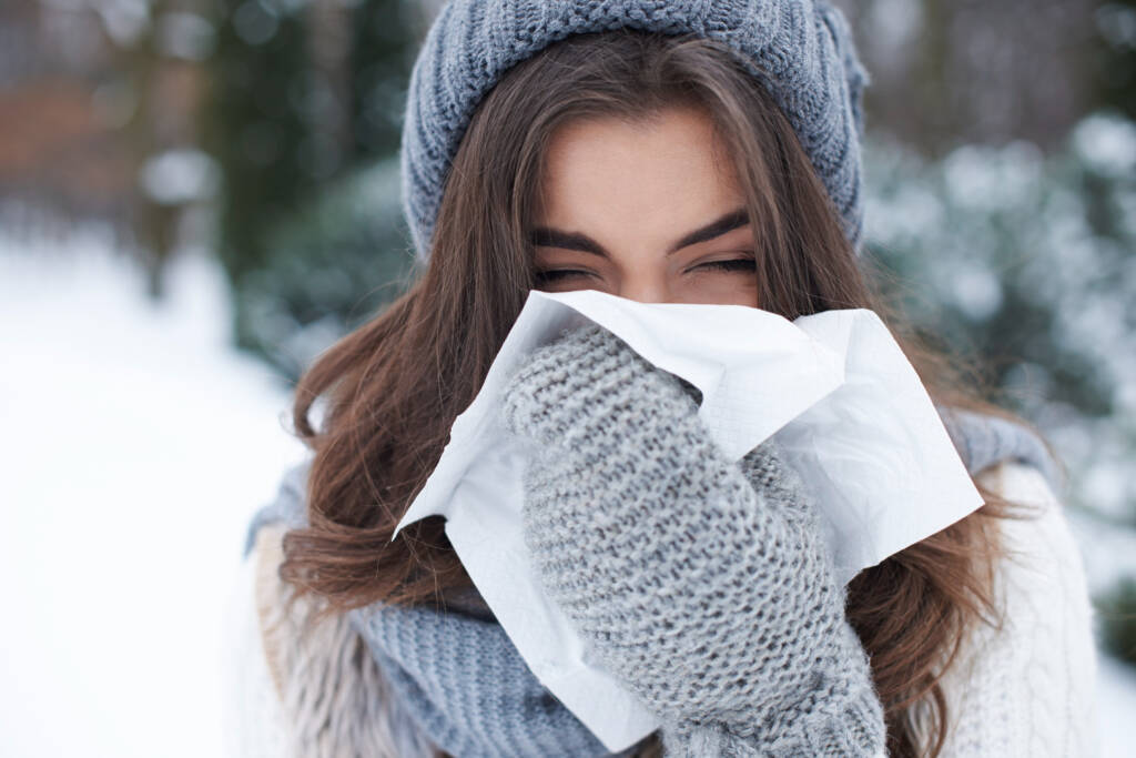 peptides for immunity woman with a handkerchief wipes her nose